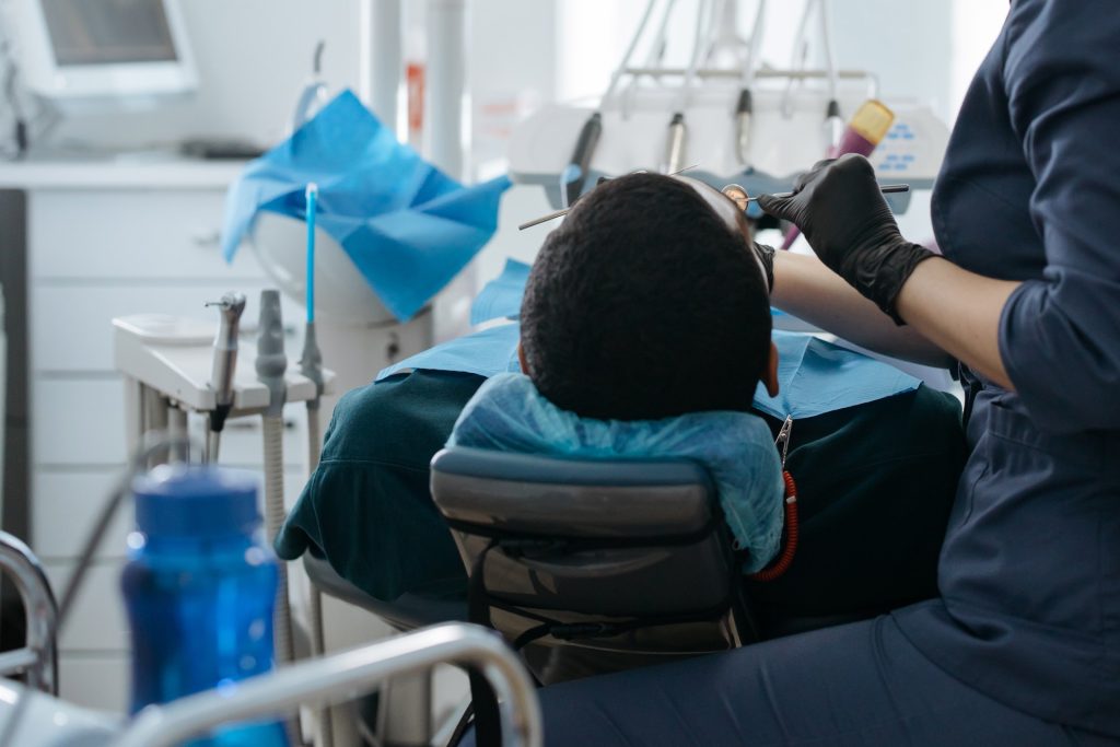 A dentist working on a patient.