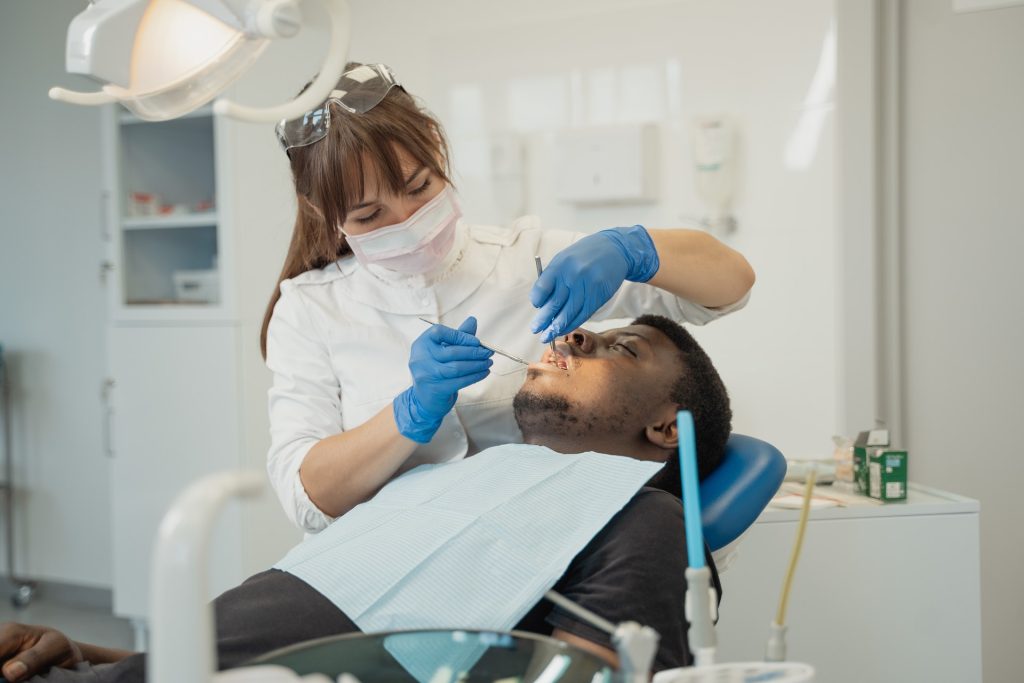 A dentist working on a patient.